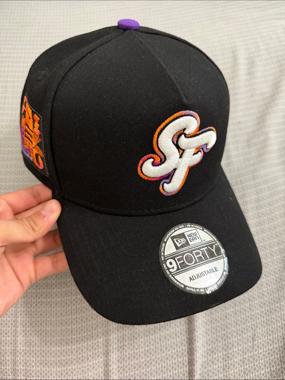 New Era Kids Black Cap with Purple and Orange Logo